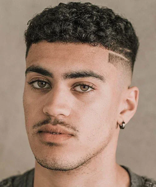 3KB Reserve client with a tight fade and defined curly top haircut